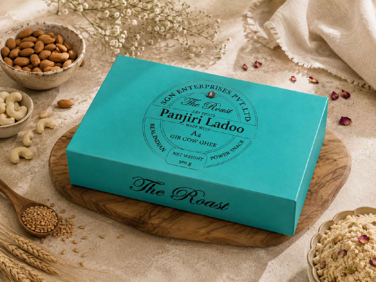 Teal mono carton with white foil branding on a wooden board