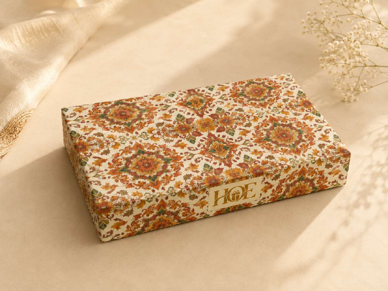 Orange floral wrapped rigid gift box on silk fabric